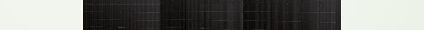 Drei komplett schwarze Solarmodule nebeneinander